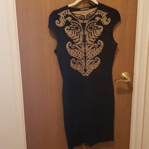 Alexander McQueen knit bk dress with a gold detail